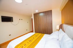Cama o camas de una habitación en Departamentos KIRI para familias o empresas que viajan en grupo cerca al Aeropuerto Juliaca