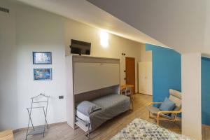 Postel nebo postele na pokoji v ubytování B&B Alla Roggetta