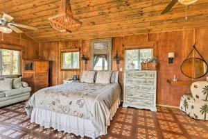 a bedroom with a bed and a wooden ceiling at Romantic Waterfront Getaway in Midway, GA! in Fancy Hall