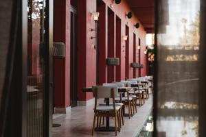 a row of tables and chairs in a building at Nobu Hotel Marrakech in Marrakesh
