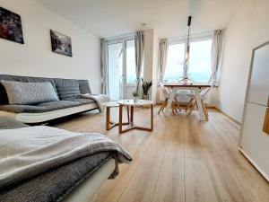 a living room with a couch and a table at Schmidis Ferienwohnung Sonthofen in Sonthofen