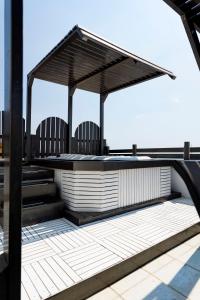 a pavilion on the roof of a building at Harbour Lounge rooms in Kardamaina