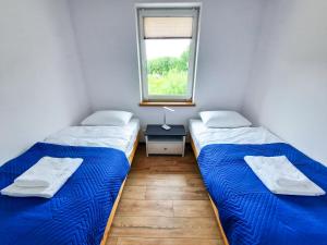 Säng eller sängar i ett rum på Apartament HARPUN nad morzem