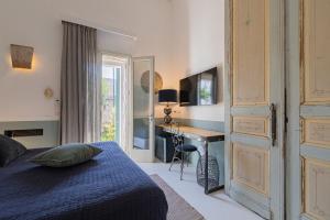 TV a/nebo společenská místnost v ubytování Dimora Lopez B&B