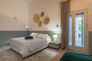 Postel nebo postele na pokoji v ubytování Dimora Lopez B&B