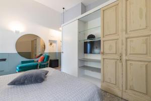 Postel nebo postele na pokoji v ubytování Dimora Lopez B&B