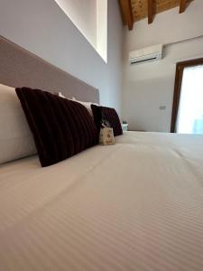 Posteľ alebo postele v izbe v ubytovaní NG Guest House il RIS