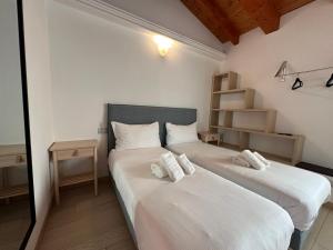 Posteľ alebo postele v izbe v ubytovaní NG Guest House il RIS