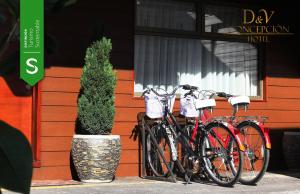 a group of bikes parked in front of a building at Hotel D&V Concepción in Concepción