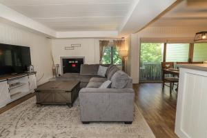 a living room with a couch and a table at Seven Springs 2 Bedroom Premium Condo, Great for families condo in Champion