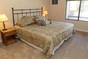 a bedroom with a large bed and a window at Seven Springs 1 Bedroom Premium Condo, Ski In Ski Out condo in Champion