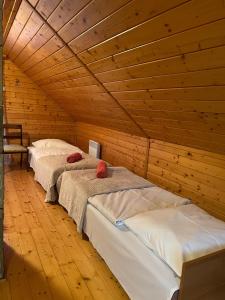 A bed or beds in a room at Chata pod Skrzycznem LuLu