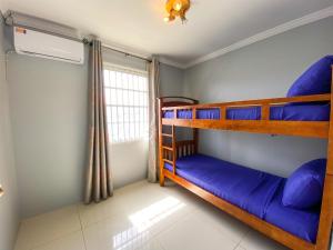 Postel nebo postele na pokoji v ubytování Benito Home
