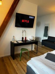 TV a/nebo společenská místnost v ubytování B&B RingLodge