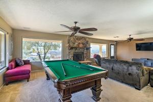 a living room with a pool table and a couch at Bullhead City Home with Private Pool, Hot Tub and View in Bullhead City