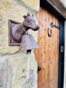 a statue of a horse head on the side of a building at The Parlour in Hexham