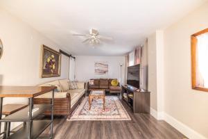 a living room with a couch and a table at Relaxed Asheville Apartment - Pet-Friendly in Asheville