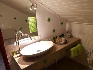 a bathroom with a sink and a mirror at Pension Sonnenheim in Winterberg +65 photos