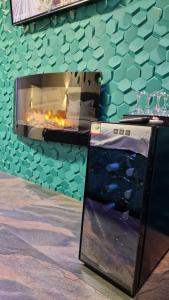 a counter with a fireplace in front of a wall at Fantasy Room in Lupeni +11 photos