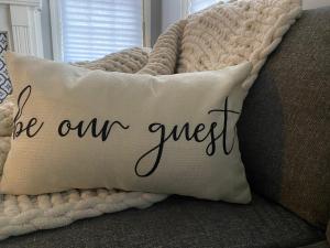 a pillow that says be our sweet on a couch at Cozy, 1st floor apartment 2bdrms Plus Semi Private room with Futon Pets with fee Family Friendly Close to Everything in Cleveland