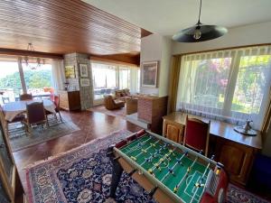 a living room with a pool table in it at Il Bell'Ovile, bellissima villa nel verde, con privacy garantita in Novaggio