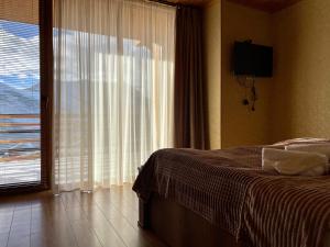 Letto o letti in una camera di Gudauri Hillsite