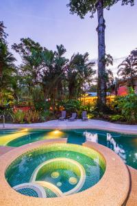 a swimming pool with a design in the middle at El Nido Jungle Lodge in Puerto Viejo