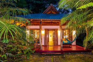 a small house in the middle of a forest at El Nido Jungle Lodge in Puerto Viejo