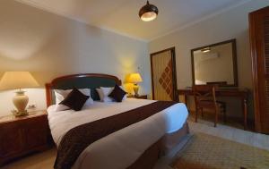 Giường trong phòng chung tại Kemet Boutique Hotel