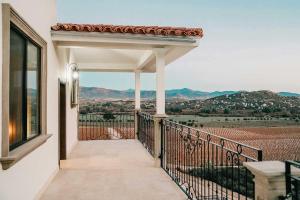 a balcony of a house with a view at Villa Montefiori in Valle de Guadalupe