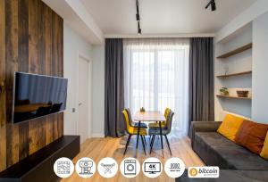 Posezení v ubytování Light and stylish 2 bedroom apartment near the Gondola lift in New Gudauri