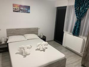 Postel nebo postele na pokoji v ubytování Casa David
