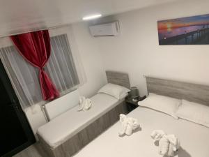 Postel nebo postele na pokoji v ubytování Casa David