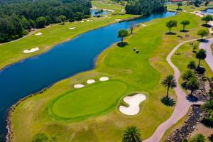an overhead view of a golf course with a river at Potomac Escape - Unit B in Palm Coast