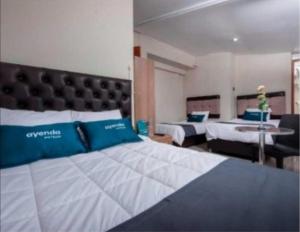 Ein Bett oder Betten in einem Zimmer der Unterkunft Hotel Luna de Oro Cusco
