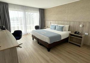 Yachting Hotel Quintero客房内的一张或多张床位