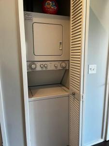 a small kitchen with a microwave in a room at Luxury Condo 2 bed 2 bath near Downtown KC in Kansas City