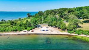 an aerial view of a beach with a group of people at Rams Head Inn in Shelter Island