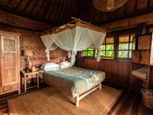 Postel nebo postele na pokoji v ubytování Sarinbuana Eco Lodge