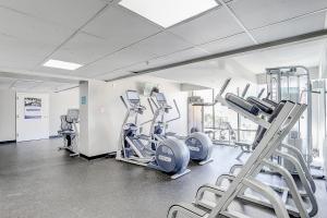 a gym with treadmills and ellipticals in a room at Caravelle Resort #622 in Myrtle Beach