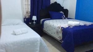 Postel nebo postele na pokoji v ubytování Hostal Magisterial Santo Domingo