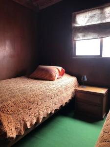 Ліжко або ліжка в номері La Casa Roja Cerro Azul