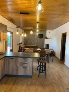 a kitchen and dining room with a table and chairs at Chalet in campagna in Partanna