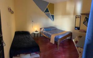 Postel nebo postele na pokoji v ubytování Hostal 23