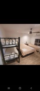 a room with two bunk beds in it at Departamentos Salvador in Termas de Río Hondo