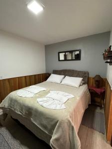Postel nebo postele na pokoji v ubytování Chalés Grindelwald