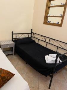 Postel nebo postele na pokoji v ubytování Casa di Paola mare Ardea