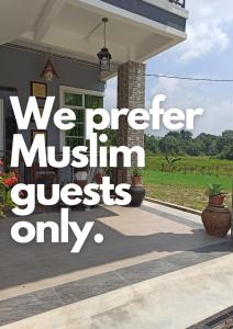 a house with a sign that reads we prefer museum guests only at Darney's Homestay Kg Bangau Tanjung in Temerloh