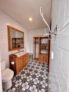 a bathroom with a sink and a toilet at The Seaglass Villas Bingin in Uluwatu +107 photos