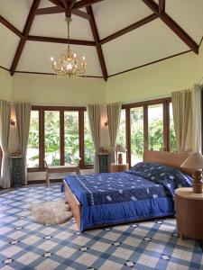 Ένα ή περισσότερα κρεβάτια σε δωμάτιο στο Gardenia Park Villa Melur